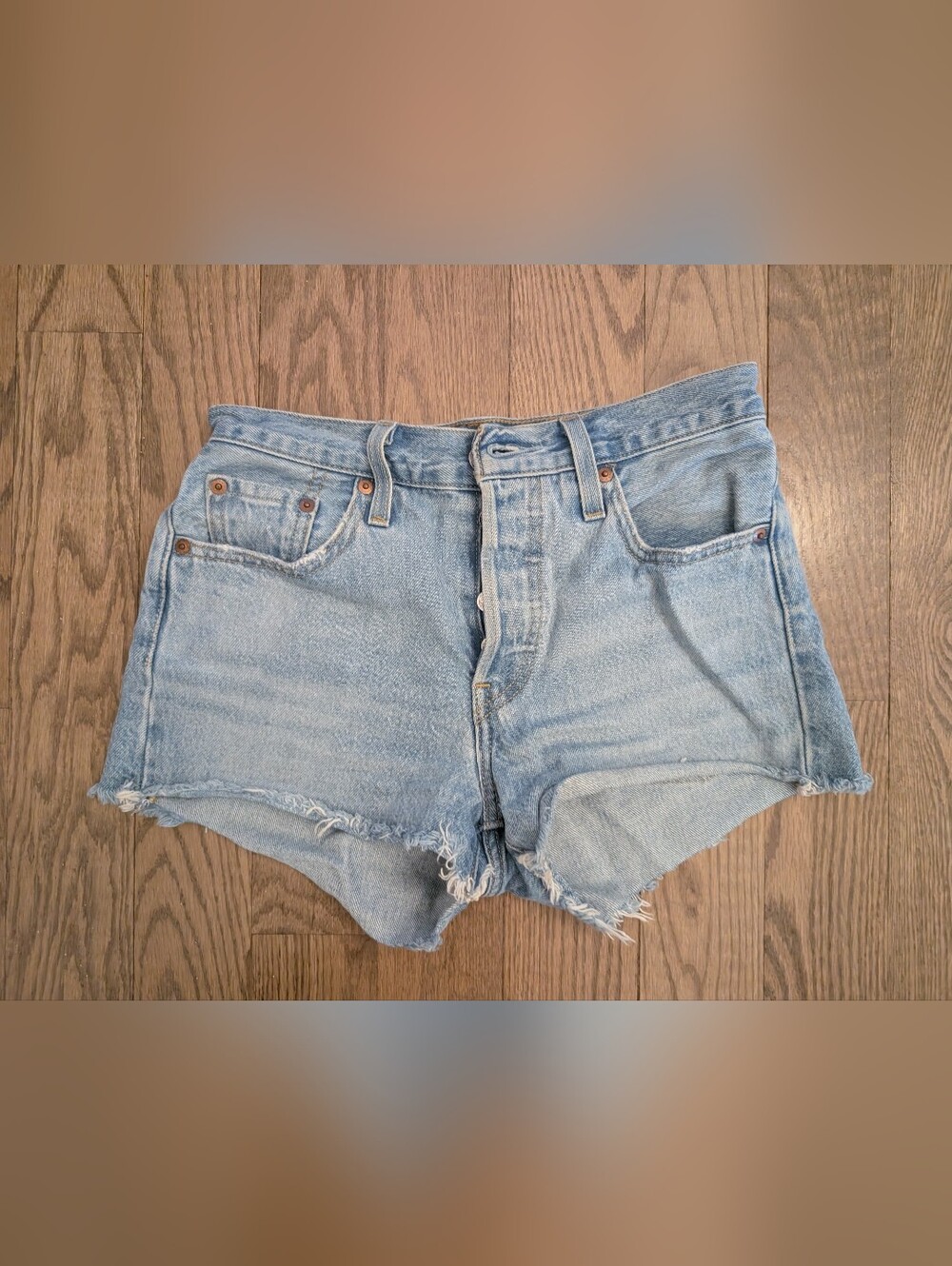 Levis High-Rise Light Blue Distressed Denim Shorts